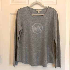 Size L Michael Kors long sleeve grey/silver shirt. Excellent condition, no smoke